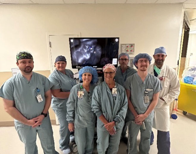Medical team standing together in hospital hallway