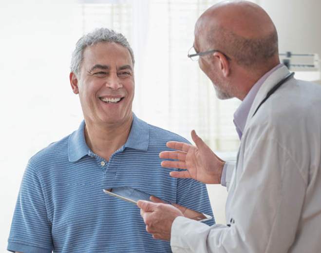 Patient talking with doctor during visit