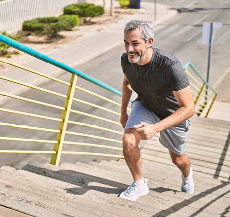 Person jogging up outdoor stairs